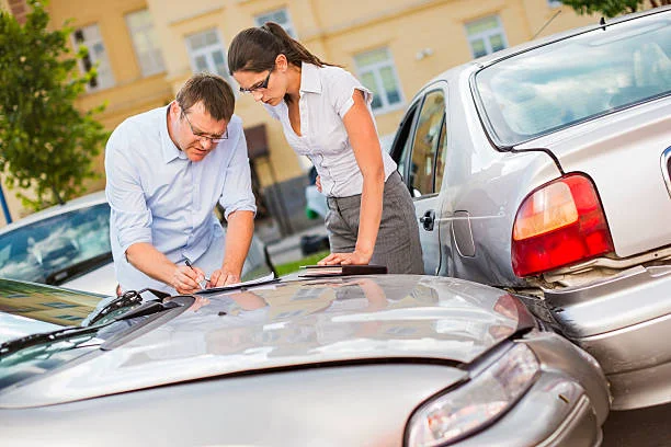 A man filing an insurance claim form