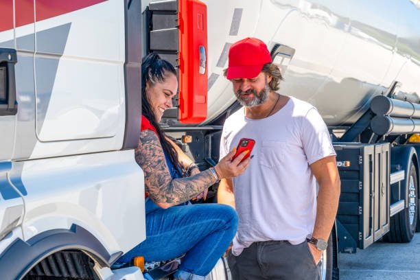 Tattooed Smiling Female Truck Driver and her Partner