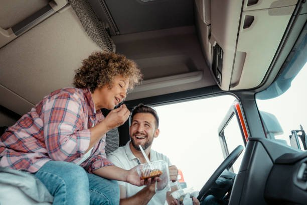 Couple Sharing Lunch in a Truck