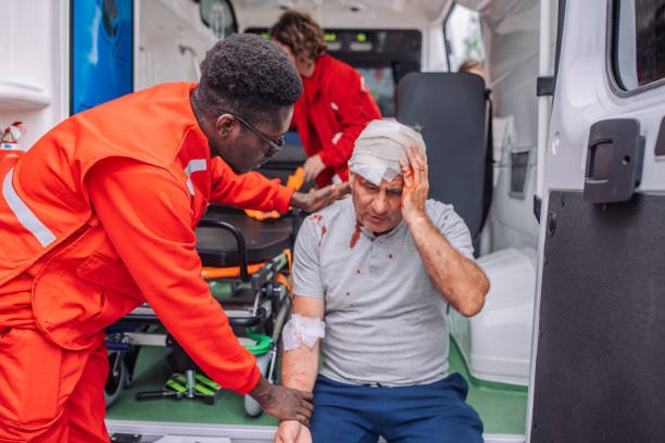 A Truck Accident Victim Receiving Treatments from a Paramedic